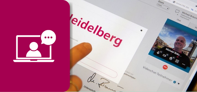 Eine Hand berüht den Touchscreen eines Tablets, worauf das virtuelle Bürgeramt mit einem Sachbearbeiter zu sehen ist