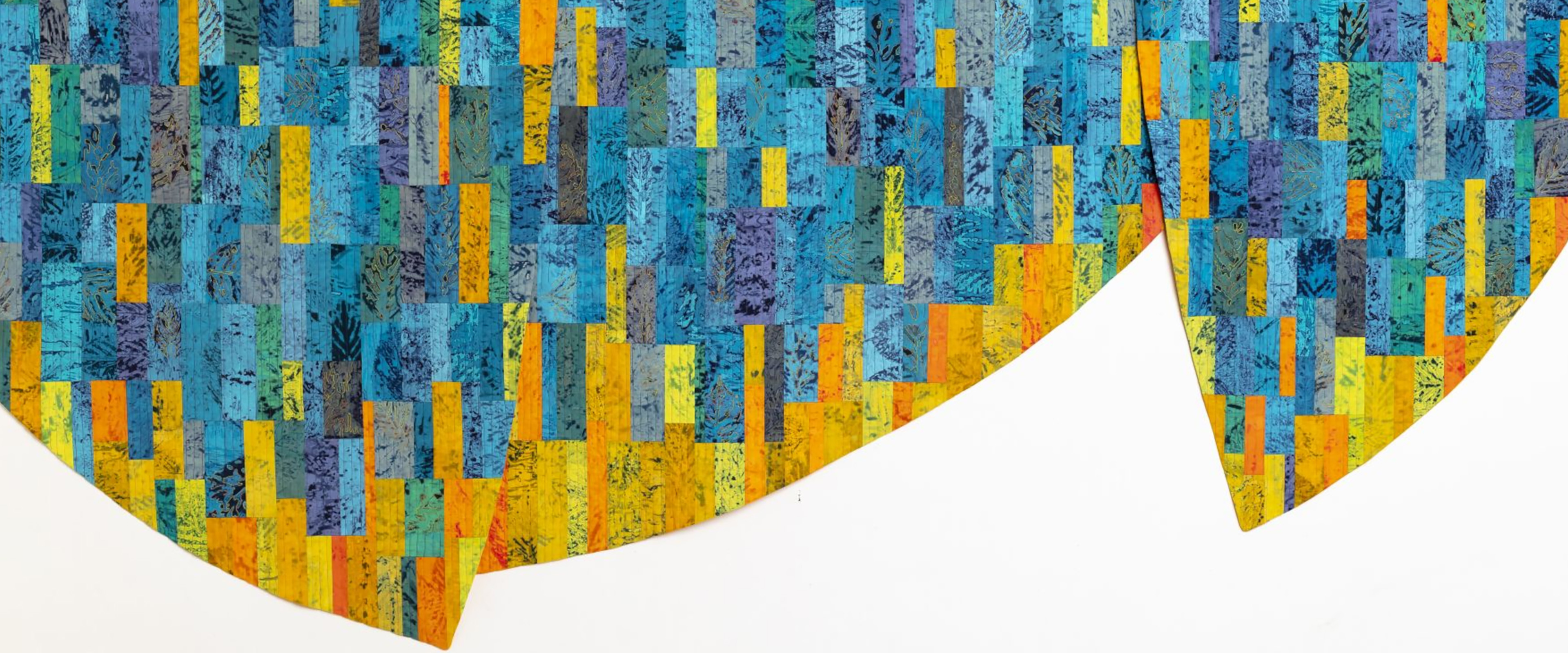 Quilt wie eine Welle in blau, gelb, orange